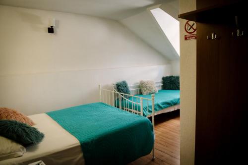 a bedroom with two beds in a room at Class in Petroşani