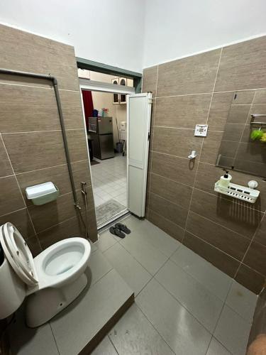 a bathroom with a toilet and a walk in shower at SM VILLA LANGKAWI full privacy home with pool in Kuah