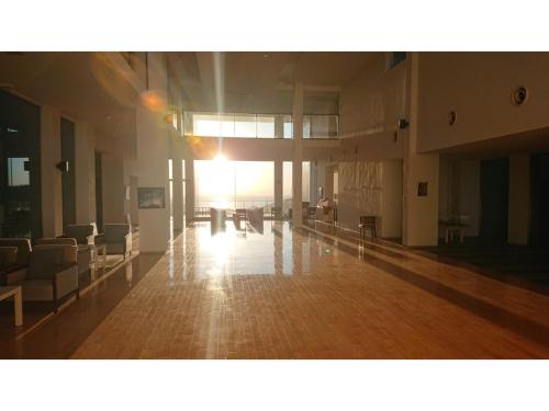 an empty room with chairs and tables in a building at Shonan Relief - Vacation STAY 51630v in Yokosuka