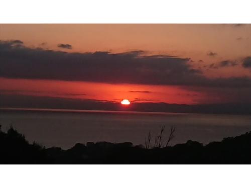a sunset over a body of water at Shonan Relief - Vacation STAY 51630v in Yokosuka