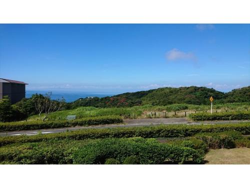 a view of a road with the ocean in the background at Shonan Relief - Vacation STAY 50852v in Yokosuka