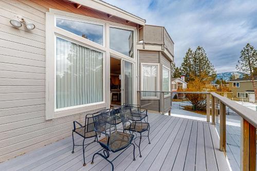 a group of chairs sitting on a deck at Rooftop Retreat in South Lake Tahoe