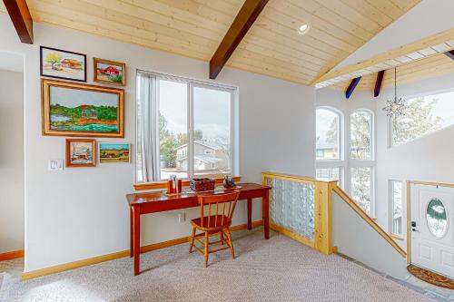 a home office with a desk and a window at Rooftop Retreat in South Lake Tahoe