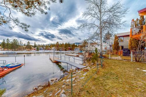 a house with a marina with a boat in the water at Rooftop Retreat in South Lake Tahoe
