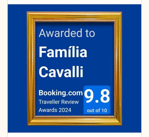 a picture frame with a sign that reads awarded to familia cavalli cavillin at Família Cavalli in Gramado