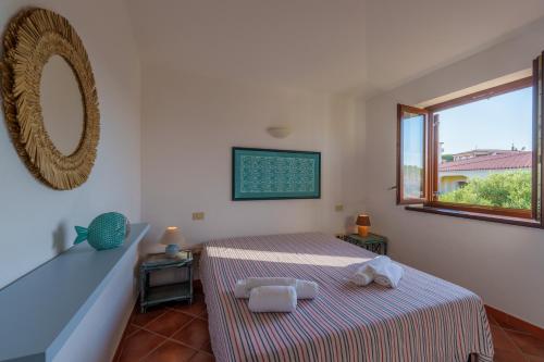 Ένα ή περισσότερα κρεβάτια σε δωμάτιο στο Appartamento Figari