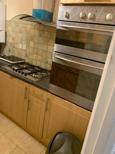 a kitchen with a stove top oven in a kitchen at Brierley close in Norwood