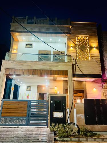 a house with a staircase in front of it at night at Villa adora in Jodhpur
