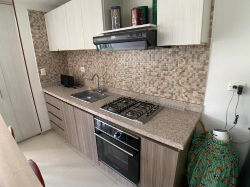 Η κουζίνα ή μικρή κουζίνα στο Apartaestudio en a Milla de oro, restaurantes, Centros comerciales, clínica Keralty