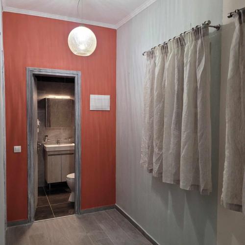 a bathroom with a toilet and a sink at Olga's Apartments in Ágios Dimítrios