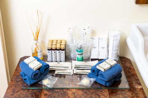 a table with blue towels and other items on it at Venice Heaven Apartments San Marco 1 & 2, the Elegant Residence a stone s throw from St Mark s Square in Venice