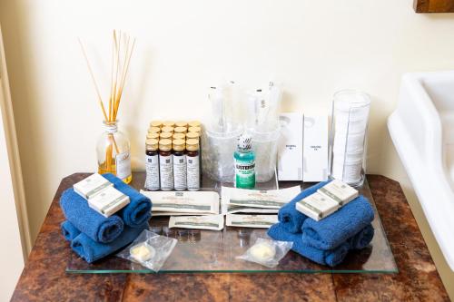 a table with blue towels and other items on it at Venice Heaven Apartments San Marco, a stone's throw away from San Marco Square in Venice