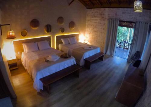 Ένα ή περισσότερα κρεβάτια σε δωμάτιο στο Amazon Premium Lodge