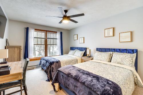 a bedroom with two beds and a ceiling fan at Cozy Cove Near Waterparks, Zip Line, Ski and More in Tannersville