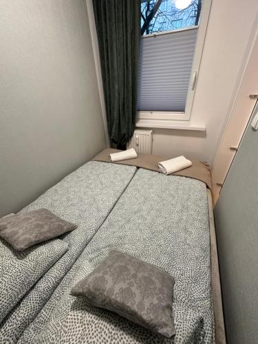 Postel nebo postele na pokoji v ubytování Studio z sypialnią na Zatorzu