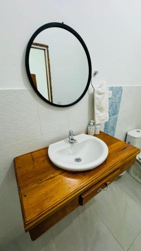 a bathroom with a sink and a mirror at Coffee House Minca in Minca