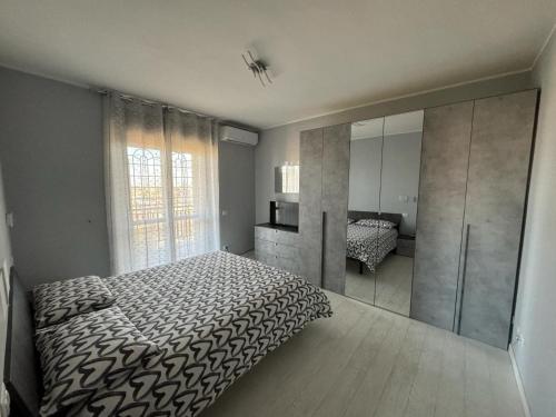 מיטה או מיטות בחדר ב-Appartamento del Parco