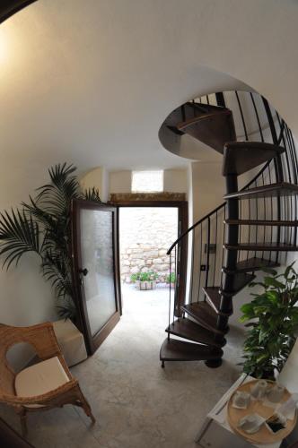 a hallway with a spiral staircase in a house at Residenza Lastene in Bovino