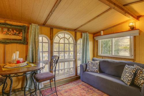 a living room with a couch and a table at Outdoor Kitchen Mtn-View Morongo Valley Cabin! in Morongo Valley