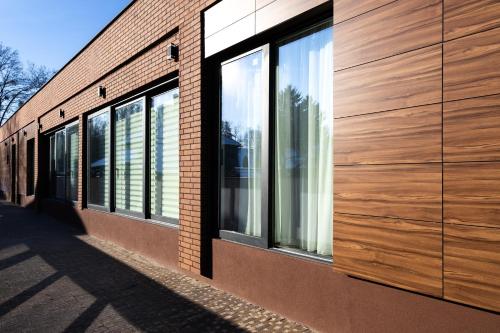 a row of windows on the side of a building at Harmonija SPA RESORT in Vrdnik