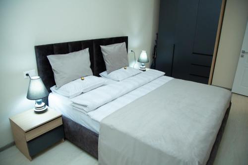 Ένα ή περισσότερα κρεβάτια σε δωμάτιο στο Sunday apart hotel