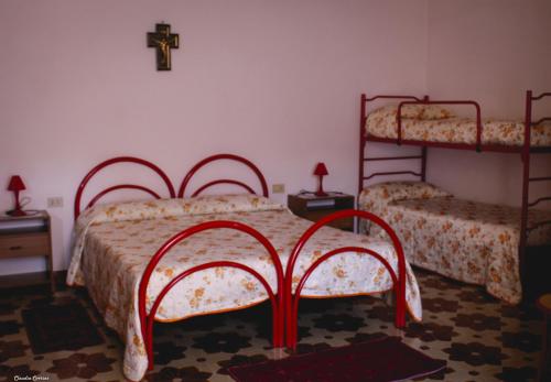 Katil atau katil-katil dalam bilik di Agriturismo Perdaba