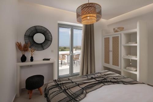 Ένα ή περισσότερα κρεβάτια σε δωμάτιο στο Nymphée Luxury Villas