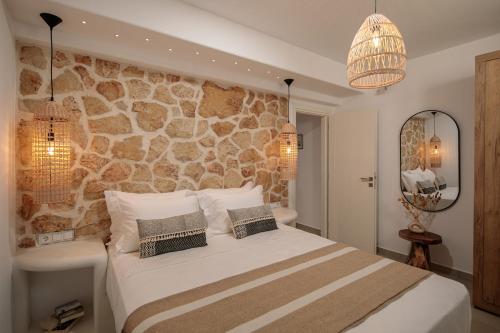Postel nebo postele na pokoji v ubytování Nymphée Luxury Villas