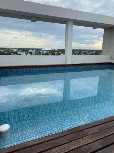 Bazén v ubytování Terrazas Resort monoambiente luminoso con piscina- cochera opcional nebo v jeho okolí