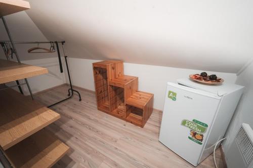 a small refrigerator with a plate of food on top of it at Pension Štěpán in Mikulov