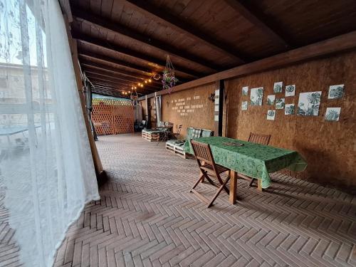 a room with a table and chairs on a patio at Itaca in Lido di Fermo