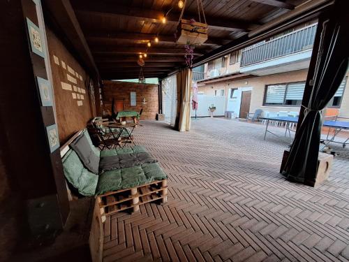 a room with a couch and a table on a floor at Itaca in Lido di Fermo