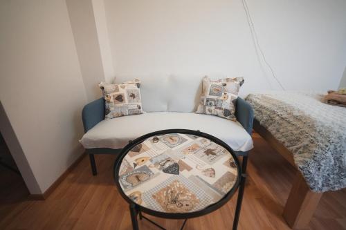a small room with a table and a bed at Pension Štěpán in Mikulov