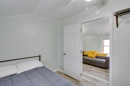 a bedroom with a bed and a mirror at Wildwood Apartment, Walk to Crest Pier and Beach! in Wildwood