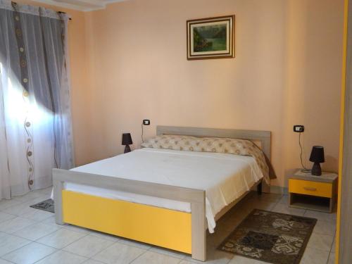 a bedroom with a large bed in a room at B&B Corte Bolandina in Taglio di Po