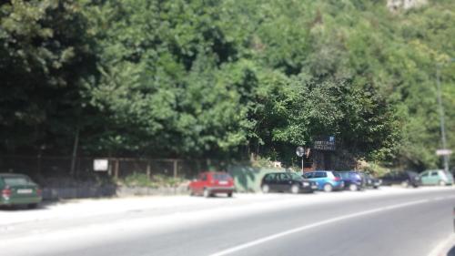 a group of cars parked on the side of a road at B&B Bazeni in Sarajevo