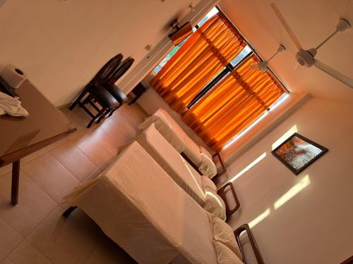 a small room with a bed and a window at Hotel Sandiego in Puerto Berrío