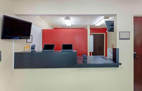 a room with a counter with two cell phones on it at Extended Stay America Select Suites - Durham - University in Durham
