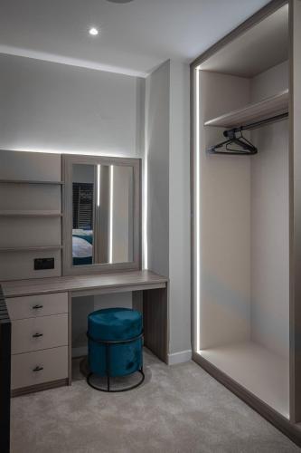 a dressing room with a mirror and a stool at The Charleston in Blackpool
