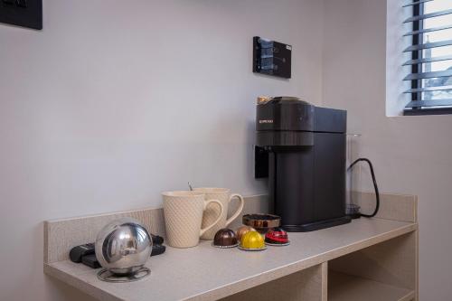 a counter with a coffee maker on top of it at The Charleston in Blackpool