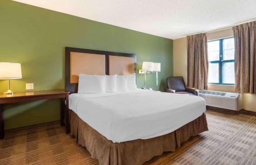 a large white bed in a hotel room at Extended Stay America Suites - Fairfield - Napa Valley in Fairfield
