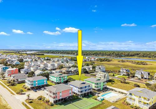 an aerial view of a suburb with a yellow arrow pointing to a house at Seven Seas-7C Condo in Holden Beach