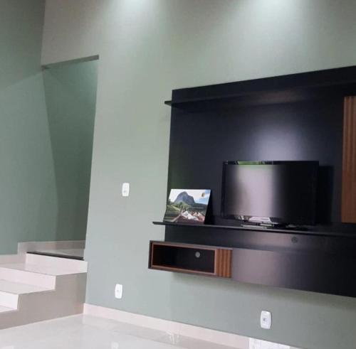 Телевизор и/или развлекательный центр в Casa da Pedra