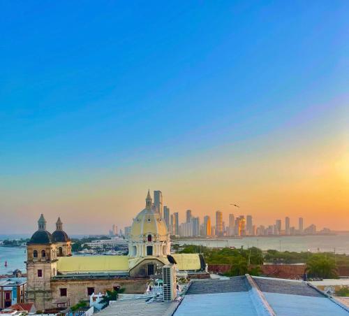 a view of a building with a city in the background at Bello apartamento corazón de Cartagena colonial in Cartagena de Indias