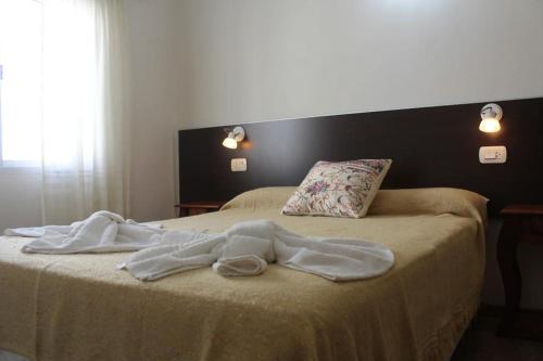 Cama ou camas em um quarto em Hotel Boiano