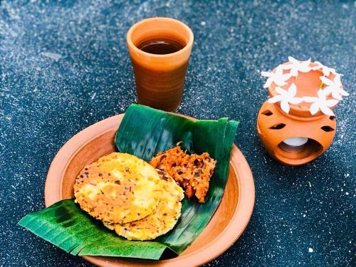a plate of food with eggs on a banana leaf at Marian Villa in Katunayaka
