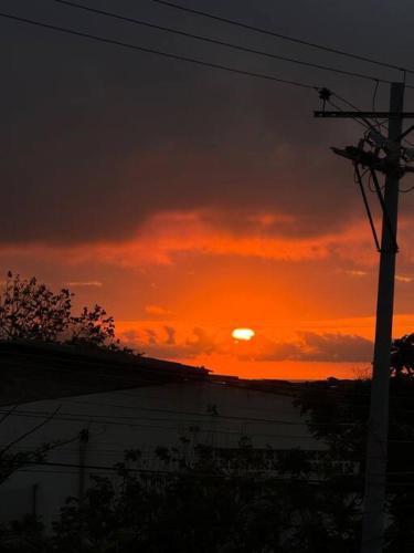 a sunset with the sun setting in the sky at Sea Lion Suite 02 in Puerto Baquerizo Moreno