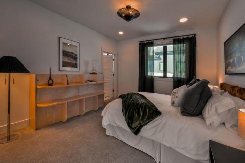 a bedroom with a bed and a sink in it at Aspects Big Sky in Big Sky