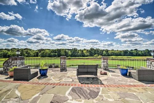 a patio with two chairs and a fence at Manor on the 7th in Gettysburg
