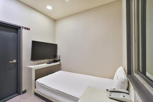 TV a/nebo společenská místnost v ubytování Top Motel Busan